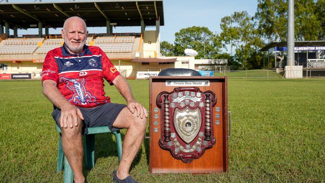 71-year-old Dennis Bree, sitting alongside the Dennis Bree Shield, is set to play in the grand final for the Palmerston Crocs. Photo: Pema Tamang Pakhrin