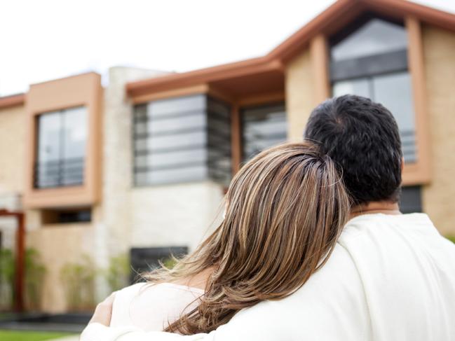 Generic photo of an Australian couple looking at property