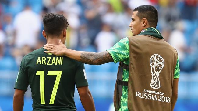 Bench weapons ... Socceroos stars Daniel Arzani (left) and Tim Cahill. Photo: Getty Images