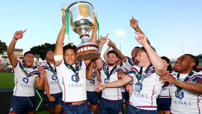 National Schoolboys Cup rugby league grand final between Ipswich SHS (white shirt) and Patrician Brothers Fairfield. – Ipswich Captain Josiah Pahulu holding trophy Redcliffe 14th September 2022 Picture David Clark