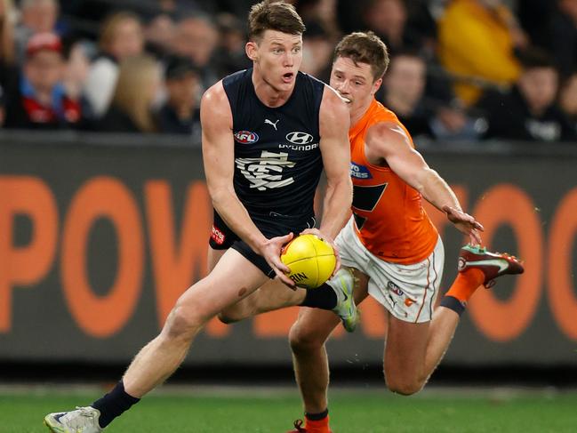 MELBOURNE, AUSTRALIA - JULY 24: Sam Walsh of the Blues is chased by Jacob Wehr of the Giants during the 2022 AFL Round 19 match between the Carlton Blues and the GWS Giants at Marvel Stadium on July 24, 2022 in Melbourne, Australia. (Photo by Michael Willson/AFL Photos via Getty Images)