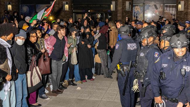 NYPD officers face protesters after detaining demonstrators and clearing an encampment set up by pro-Palestinian students and protesters on the campus of New York University. Picture: AFP