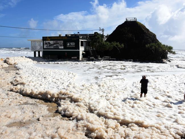 Currumbin Vikings Surf Life Saving Club was cut off from the street on Monday as a large swell and heavy rain flooded the carpark. Picture: NCA NewsWire / Steve Holland