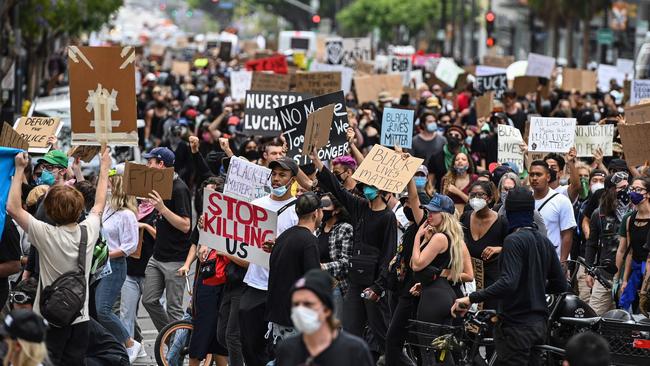 Demonstrators march through the streets of Hollywood, California.