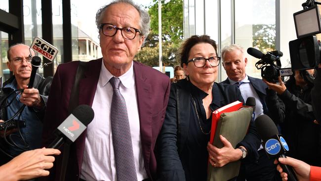 ‘Yummy has a spirit to it’ ... actor Geoffrey Rush leaves the Federal Court in Sydney with his wife, actress Jane Menelaus. Picture: AAP