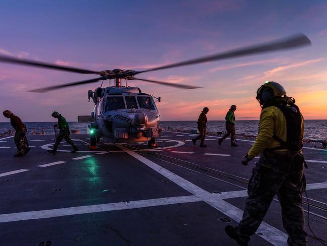 HMAS Hobart’s embarked MH-60R helicopter “Voodoo” prepares to launch during flying operations during a Regional Presence deployment. *** Local Caption *** The Royal Australian Navy Hobart class guided missile destroyer, HMAS Hobart is undertaking an Indo-Pacific Regional Presence Deployment throughout South and Southeast Asia. During the deployment, Hobart is conducting training, exercises and other engagements with Australia's regional partners and will contribute to Operation ARGOS, the Australian Defence Force's contribution to international efforts to enforce United Nations Security Council sanctions against North Korea. Regional Presence Deployments demonstrate Australia's commitment to, and engagement with, the region. The deployments play a vital role in Australia's long-term security and prosperity by protecting Australia's interests, preserving a rules-based order, enhancing cooperation and relationships with regional partners and allies, and developing capability and interoperability.