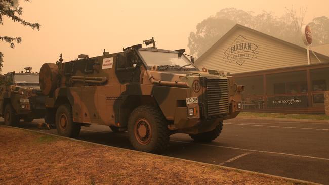 Army trucks on the main street of Buchan. Picture: David Crosling