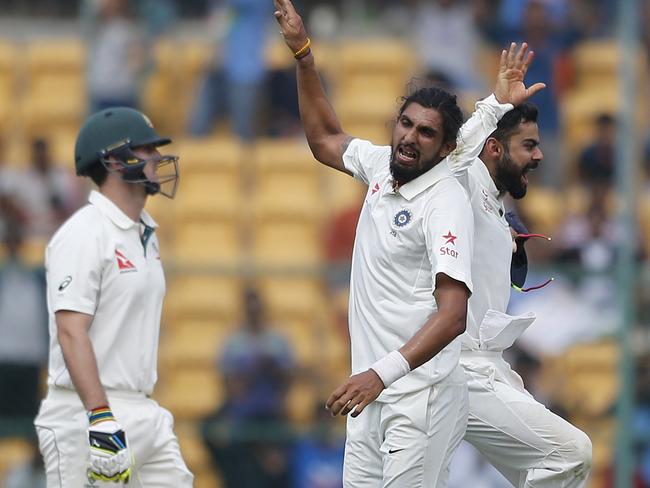 India celebrate the dismissal of Mitchell Marsh in Bangalore.
