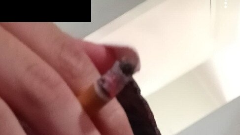 A Gold Coast teenager who was in foster care is now on the streets, smoking and using drugs - in this blurred out photograph she had a white powder on her tongue.