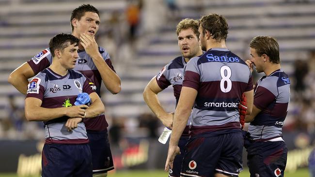 The Queensland Reds look despondent after being beaten by the Jaguares in Buenos Aires.