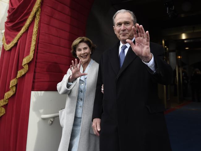 Former President George W. Bush and his wife Laura Bush wave as they arrive on Capitol Hill in Washington on January 20, 2017. Picture: AP