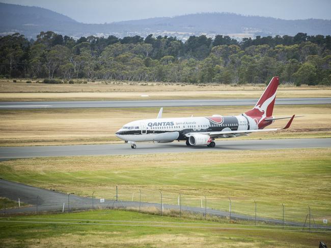 A qantas passenger plane with indigenous artwork departs Hobart Airport. Picture: RICHARD JUPE File / generic / travel / departure / Hobart Airport