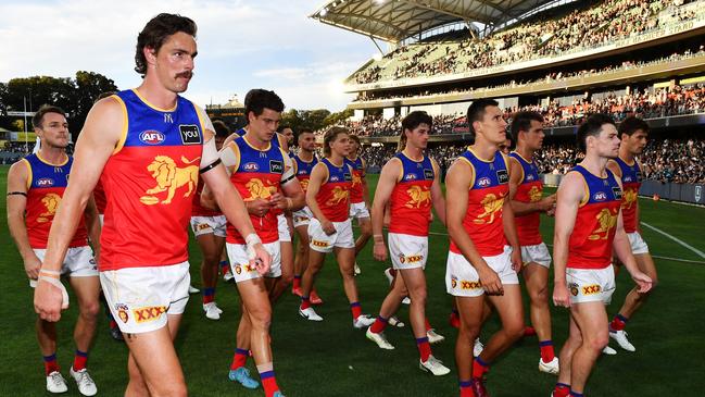 ADELAIDE, AUSTRALIA - MARCH 18: Joe Daniher of the Lions ;lead his team off after  the round one AFL match between Port Adelaide Power and Brisbane Lions at Adelaide Oval, on March 18, 2023, in Adelaide, Australia. (Photo by Mark Brake/Getty Images)