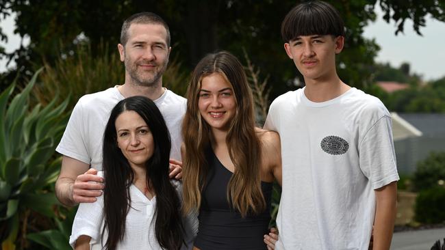 24th of November 2024  - Ryan and Christine Boyle with son Eli, 13 and daughter Meeka, 15, at their home in Noarlunga Downs.Chrstine Boyle is a 39-year-old wife and mother of two teenage children. After only five weeks of experiencing shortness of breath and three weeks after an initial visit to the doctor, she received the devastating diagnosis of stage four metastatic cancer. Christine has undergone open-heart surgery to remove a tumour growing in her pulmonary artery. She is currently recovering, before beginning chemotherapy although she is in palliative care. Naomi Jellicoe