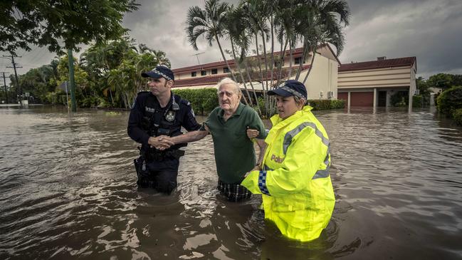 Terry Rowland, 82, is rescued from his flooded home in Hermit Park, Townsville. Picture: Glenn Hunt.