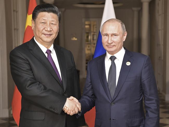 FILE - In this July 26, 2018, file photo, China's President Xi Jinping, left, poses with Russia's President Vladimir Putin for a photo at the BRICS summit in Johannesburg, South Africa. Chinaâ€™s foreign ministry said Friday, Sept. 7, 2018, Xi will meet with Putin on Sept. 11 and 12  in a sign of strengthening ties between the two Asian giants. (Alexei Nikolsky, Sputnik, Kremlin Pool Photo via AP, File)