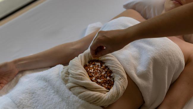 No, they’re not making pizza – this is one of the many unique wellness treatments you can get at Layan Life.