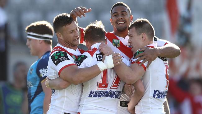 SYDNEY, AUSTRALIA — AUGUST 12: Tariq Sims, Nene MacDonald and Cameron McInnes of the Dragons celebrate with Kurt Mann of the Dragons after he scored a try during the round 23 NRL match between the St George Illawarra Dragons and the Gold Coast Titans at UOW Jubilee Oval on August 12, 2017 in Sydney, Australia. (Photo by Mark Kolbe/Getty Images)