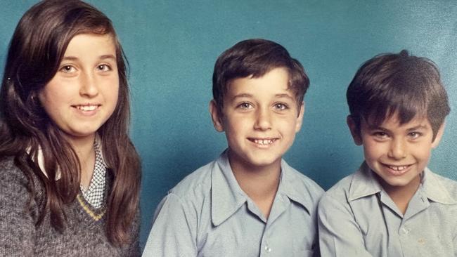 John Pesutto as a child, pictured with his sister Chiarina and brother George. Picture: Supplied Nick Johnston