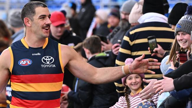 Crows veteran Taylor Walker interacts with fans this year. Picture: Steve Bell/Getty Images