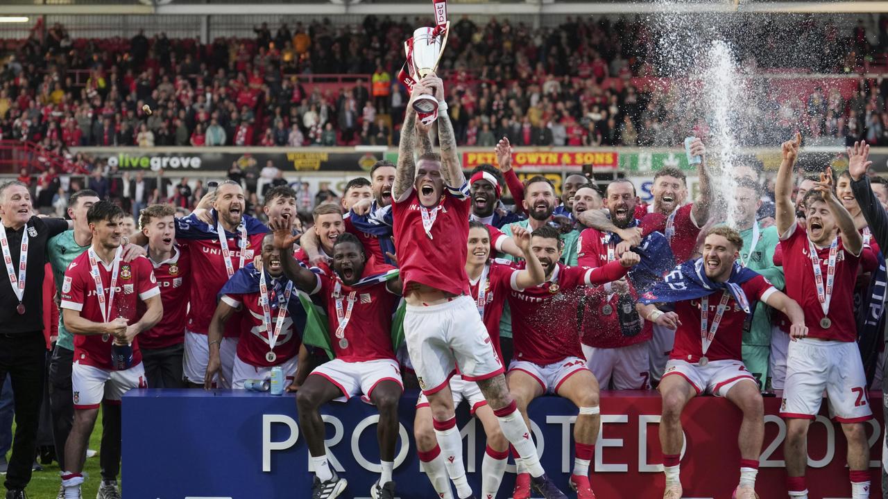Wrexham have risen up the ranks of British football after being purchased by two Hollywood A-listers. Picture: AP Photo/Jon Super