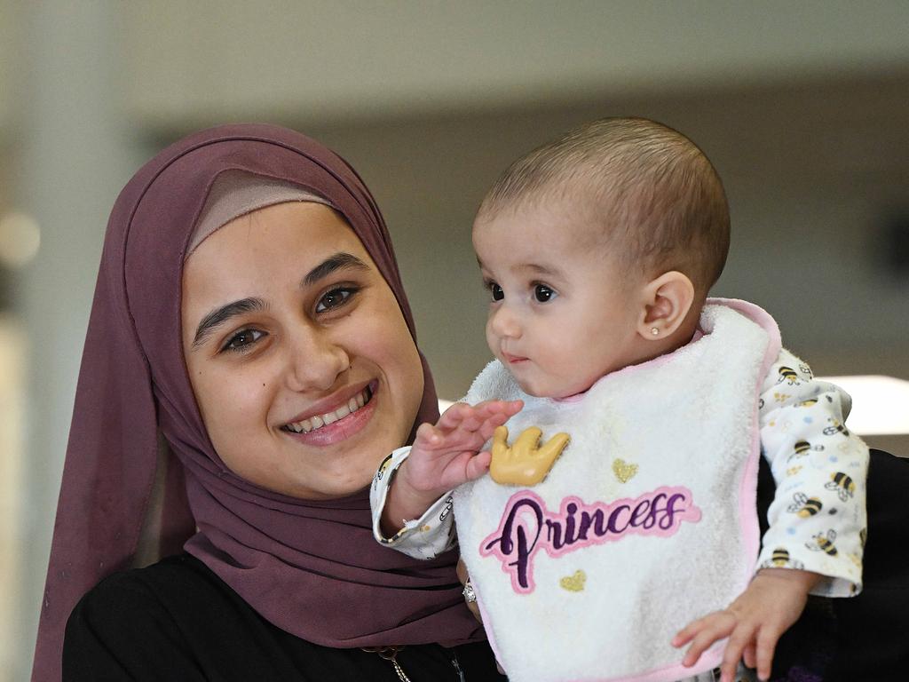 Sidra Issa and her baby Amina Alawi arrive at Brisbane International Airport. Picture: Lyndon Mechielsen/Courier Mail