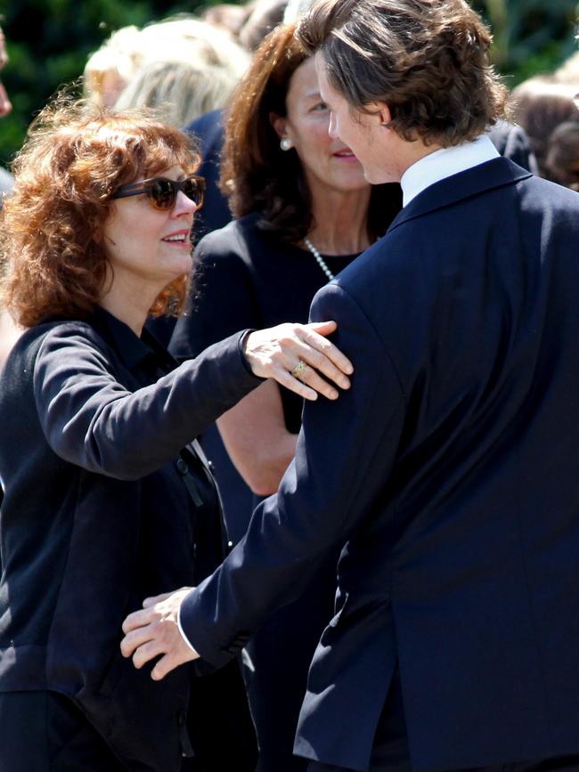 Actress Susan Sarandon, second from left, reaches out to hug a member of the Kennedy family after the funeral of Mary Richardson Kennedy. (AP Photo/Craig Ruttle)