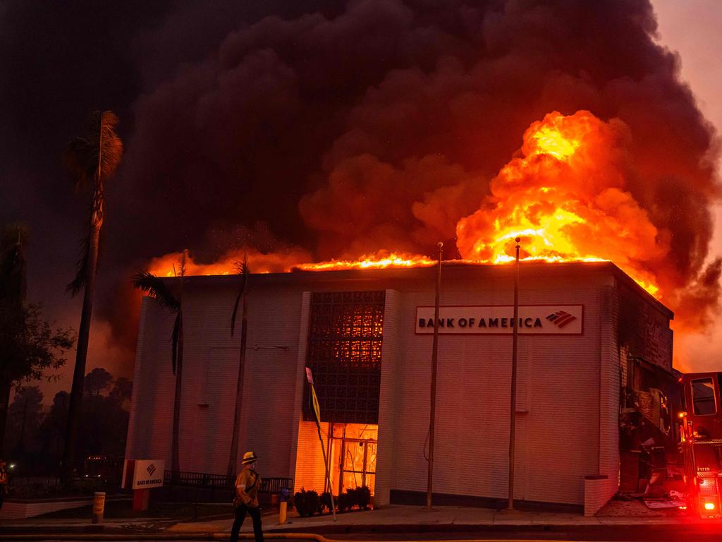 At least five people are now known to have died in wildfires raging around Los Angeles, with more deaths feared. (Photo by JOSH EDELSON / AFP)