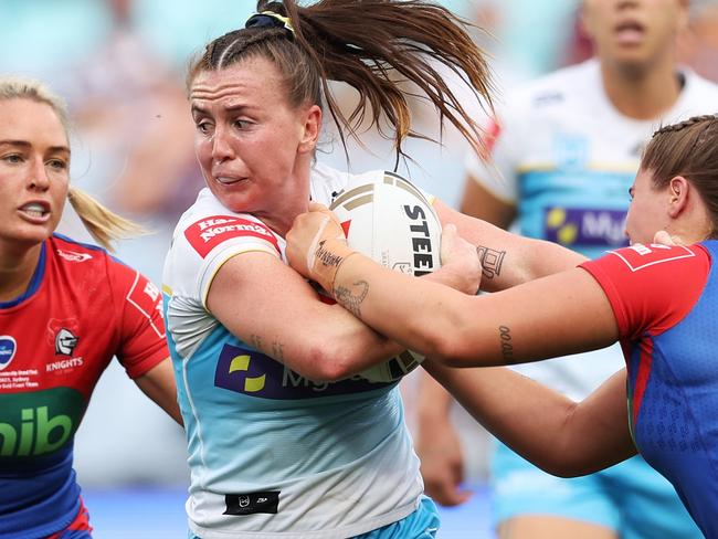 SYDNEY, AUSTRALIA - OCTOBER 01:  Georgia Hale of the Titans is tackled during the 2023 NRLW Grand Final match between Newcastle Knights and Gold Coast Titans at Accor Stadium, on October 01, 2023, in Sydney, Australia. (Photo by Matt King/Getty Images)
