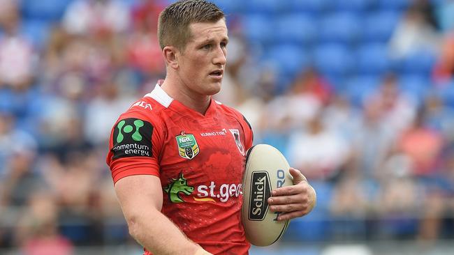GOLD COAST, AUSTRALIA - APRIL 16: Josh McCrone of the Dragons waarms up on the field with team mates before the round seven NRL match between the Gold Coast Titans and the St George Illawarra Dragons at Cbus Super Stadium on April 16, 2016 in Gold Coast, Australia. (Photo by Matt Roberts/Getty Images)
