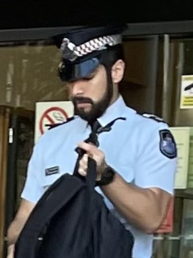 Queensland Police Service Senior Constable Renzo Martinez leaves court after giving evidence at an inquest into a death in custody incident where a man died enroute to Rockhampton watch house in November 2019 after being arrested and restrained in the Leichhardt Hotel car park, on Bolsover Street, across the road from the police station and watch house.