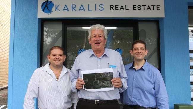 Michael Sunderland (centre) at Karalis Real Estate at Mt Gravatt Central. Photo: Kristy Muir