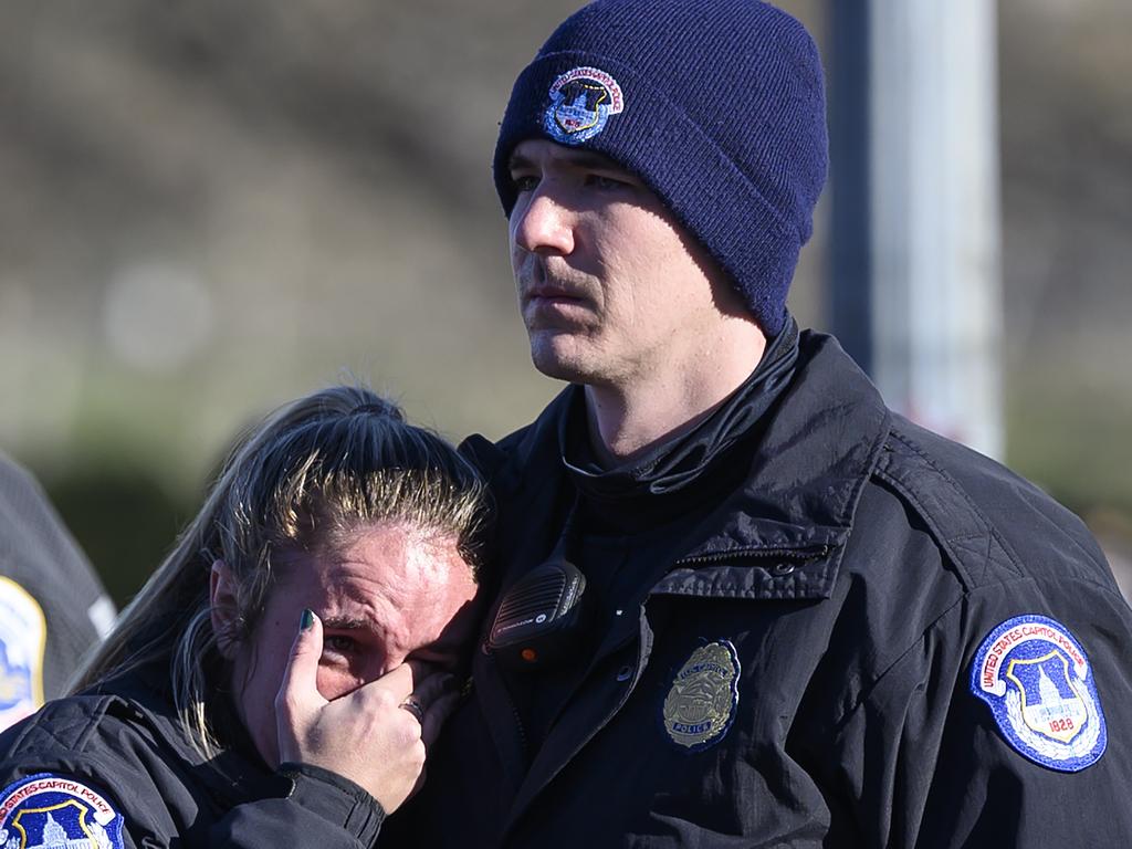 US Capital police react after the casket with fallen police officer, Brian Sicknick, passed during a funeral procession in Washington, DC on Sunday. Picture: AFP