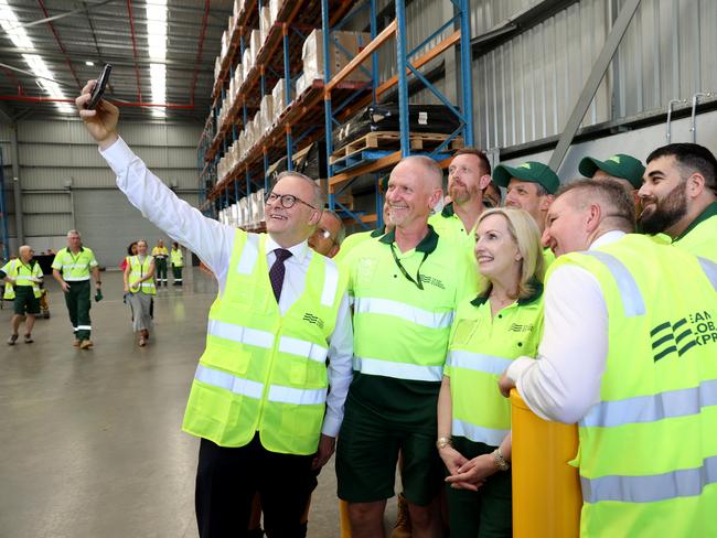 Albanese and Bowen taking pictures with the Team Global Express staff. Picture: Damian Shaw