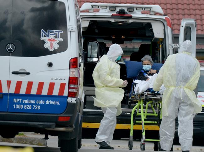 MELBOURNE, AUSTRALIA - NewsWire Photos JULY 27: Medical staff remove patients from St Basil's Home for the Aged at Fawkner. Picture: NCA NewsWire / Andrew Henshaw