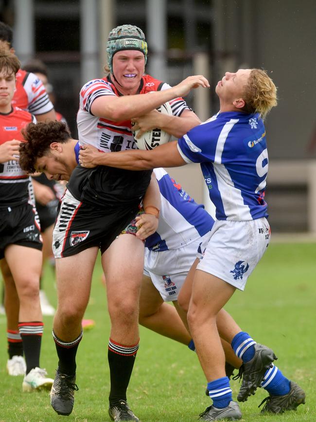 Kirwan No.13 Diesel Taylor fends off Kyhnaan Kennedy of Ignatius Park College. Picture: Evan Morgan