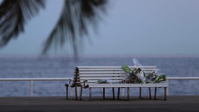 Flowers and cards left for victims following the deadly Bastille Day attack along the Promenade des Anglais in Nice, which is still closed. AFP PHOTO / Valery HACHE