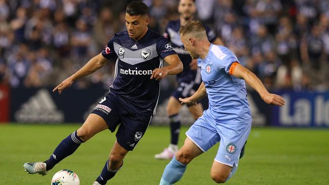 Melbourne Victory striker Andrew Nabbout takes on Melbourne City defender Scott Jamieson on Saturday night. Picture: Getty Images