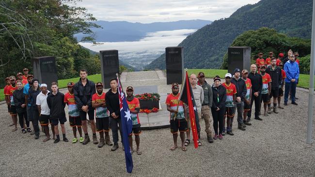 Members of the Youth Leadership Challenge with tour officials and residents at Kokoda.