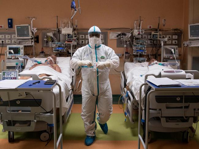 A doctor attends to patients in intensive care in the COVID-19 ward of the Maria Pia Hospital in Turin. Picture: AFP