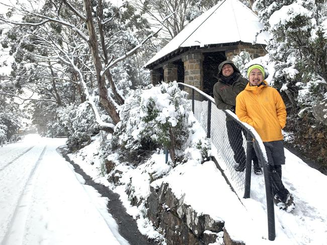 Alex Hormann and Jason Lee enjoy the 20cm deep snow at the Chalet on kunanyi/Mt Wellington on June 7 2022