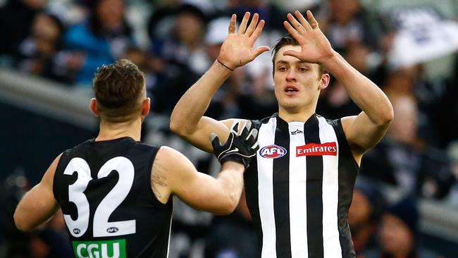 Travis Cloke and Darcy Moore. Photo: Adam Trafford/AFL Media/Getty Images