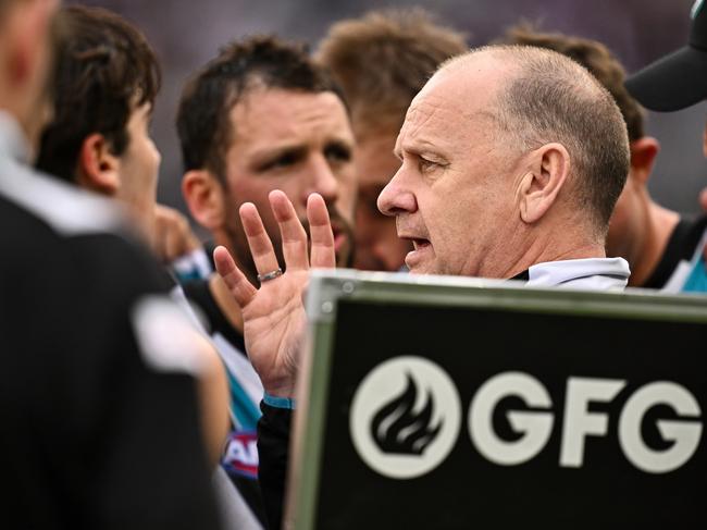 PERTH, AUSTRALIA - AUGUST 25: Ken Hinkley, Senior Coach of the Power addresses the players at the break during the 2024 AFL Round 24 match between the Fremantle Dockers and the Port Adelaide Power at Optus Stadium on August 25, 2024 in Perth, Australia. (Photo by Daniel Carson/AFL Photos via Getty Images)