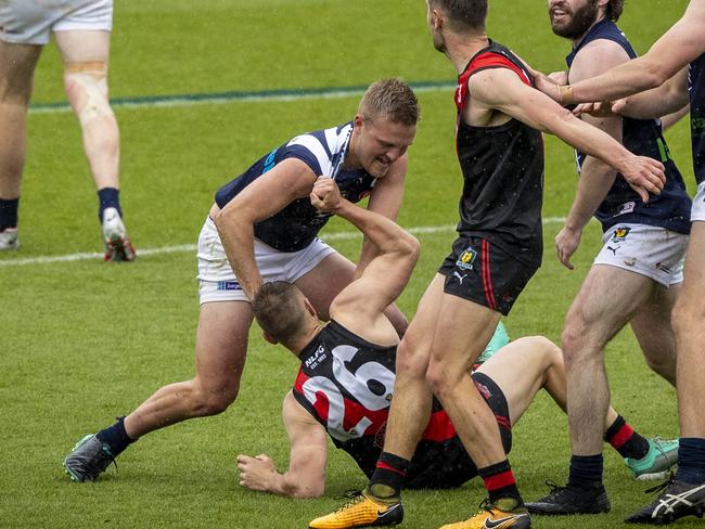 The TSL Grand Final was a slugfest from start to finish. Launceston’s Jamieson House (standing) and North Launceston’s Jay Foon brawl in the centre square. Picture: LUKE BOWDEN