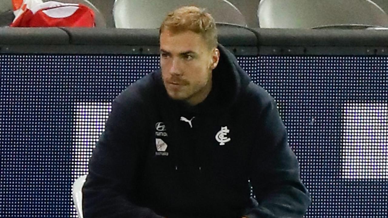 Harry McKay watches from the sidelines after leaving the game early against St Kilda.