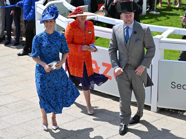 Zara Phillips, British broadcaster Clare Balding and Mike Tindall attend the second day of the Epsom Derby Festival horse racing meeting at Epsom Downs Racecourse. Picture: AFP