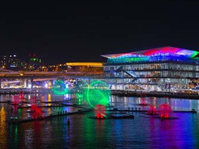 From either Barangaroo or Darling Harbour you’ll see Fantastic Oceans, an art-meets-technology water fountain, light and laser experience floating on Cockle Bay. Picture: Steve Christo