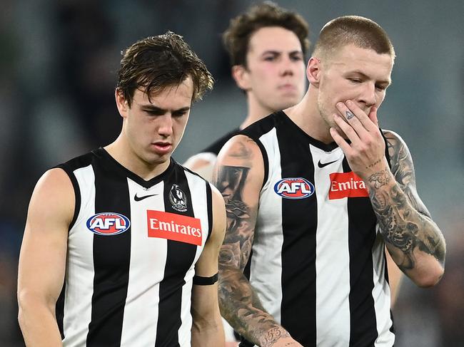 MELBOURNE, AUSTRALIA - MAY 23: Callum L. Brown, Jordan De Goey, Steele Sidebottom and Josh Thomas of the Magpies look dejected after losing the round 10 AFL match between the Collingwood Magpies and the Port Adelaide Power at Melbourne Cricket Ground on May 23, 2021 in Melbourne, Australia. (Photo by Quinn Rooney/Getty Images)