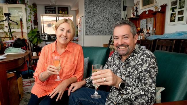 Liz DeLaine and Peter Leske, at their unit in Largs, cracked the champagne on news that the Reserve Bank has finally made a cut to the cash rate. Picture: Dean Martin