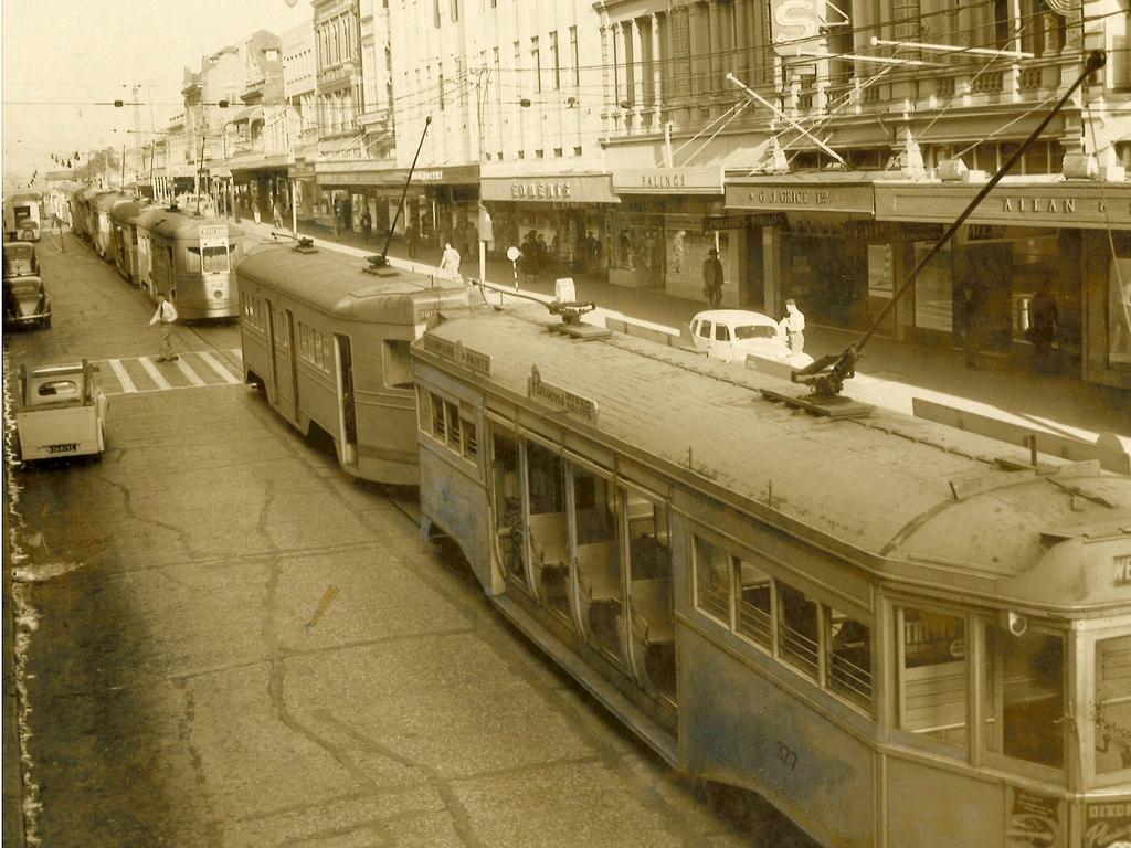 Trams bank up on Queen St after a woman was struck in May 1953